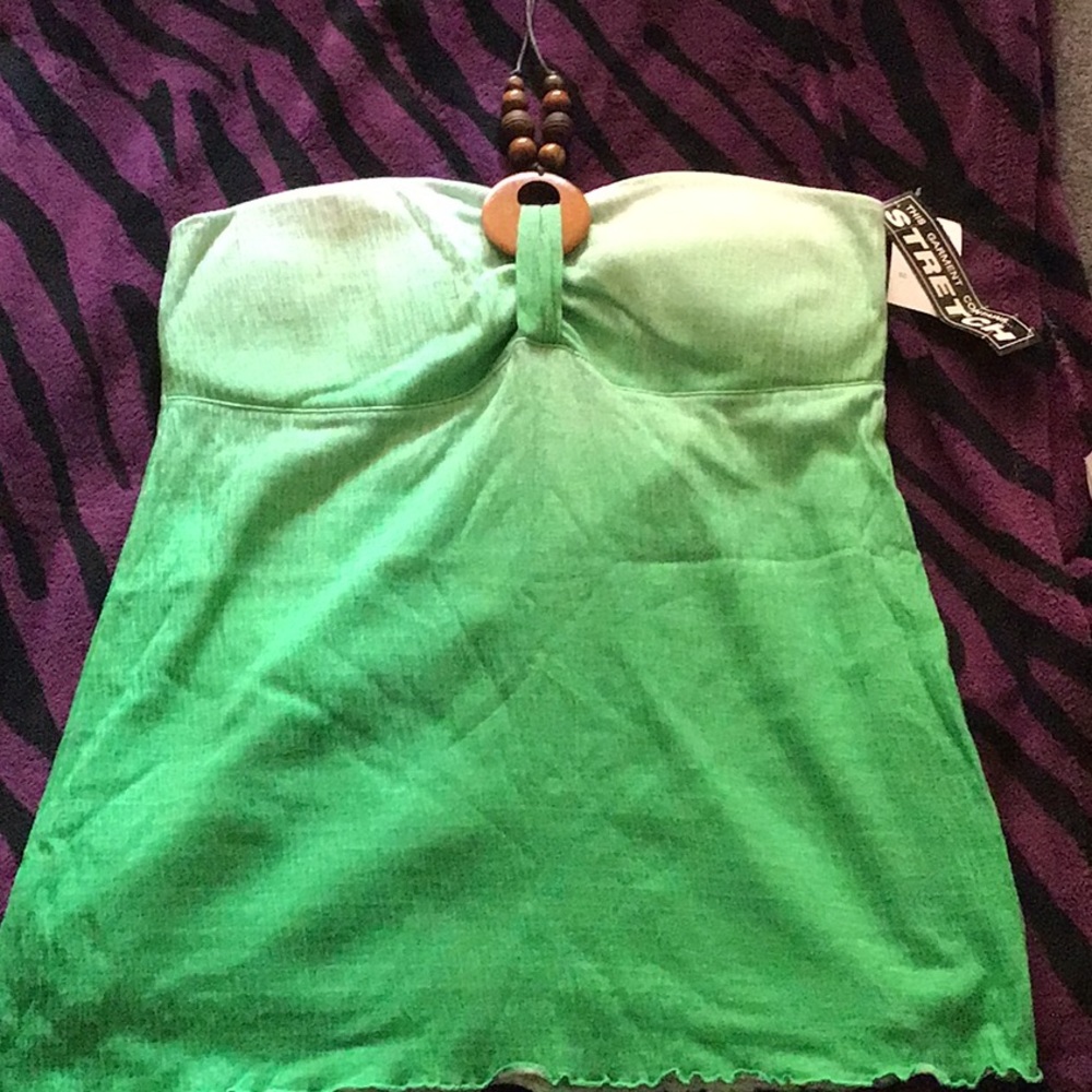 A two tone green tank top and ties around neck.